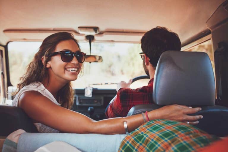 Man and woman happy in car