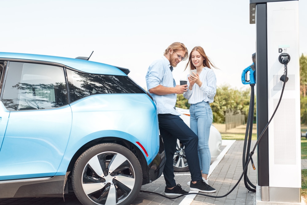 Couple charging their Electric Vehicle in Australia