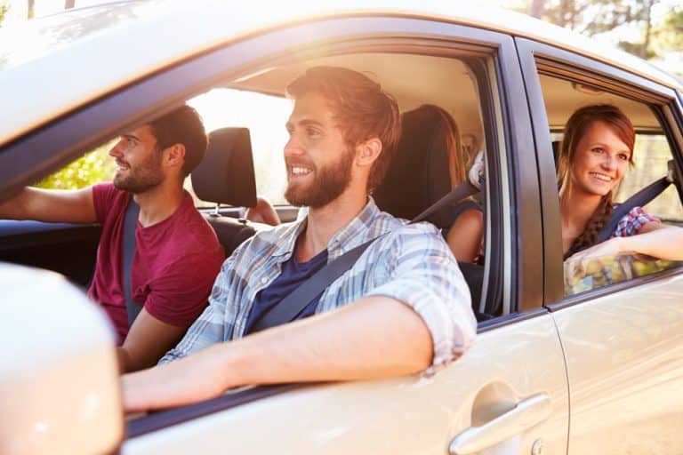 Car Insurance Banner - Group of friends driving around in a car.