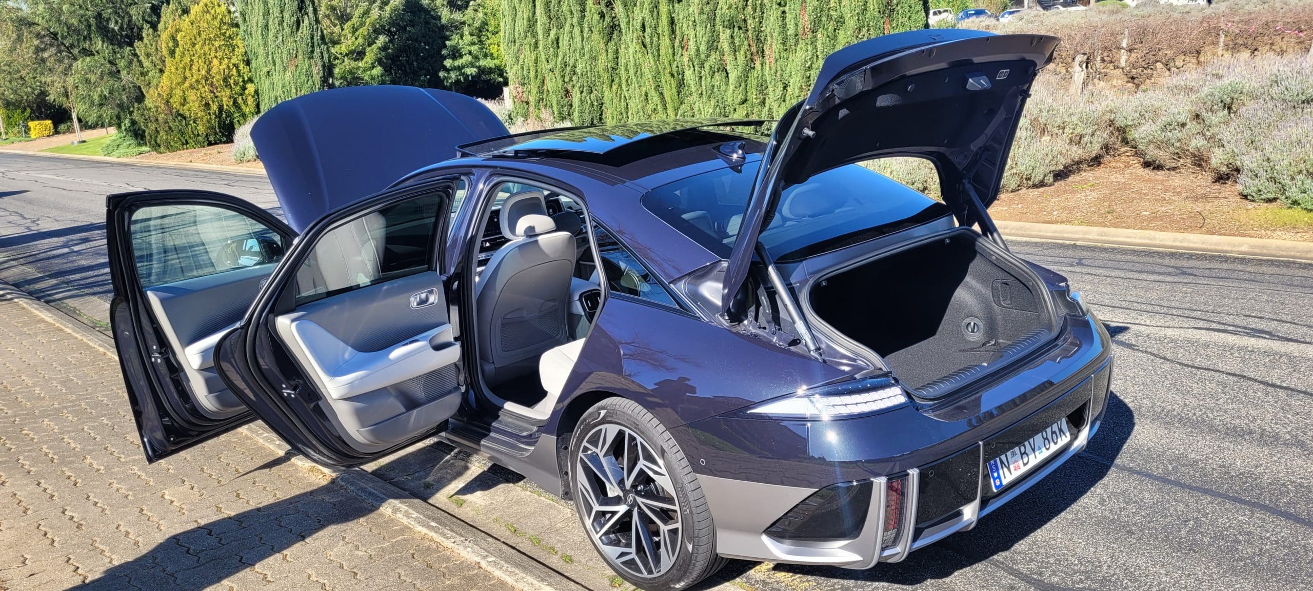 Black Hyundai IONIQ 6 TECHNIQ with boot and all doors open