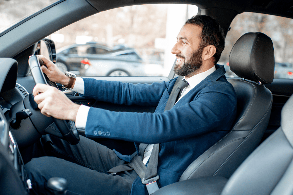 Car Loans Banner - Businessman driving his car