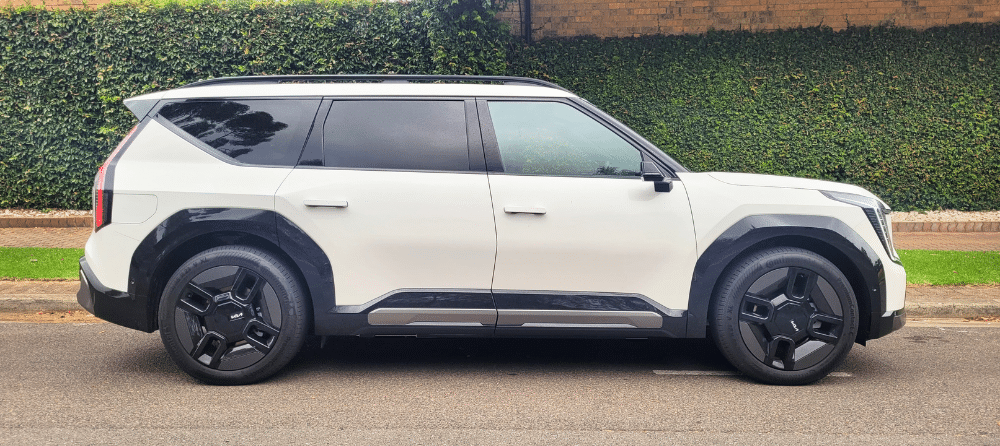 Kia EV9 2024 model with black rims - side view parked on street