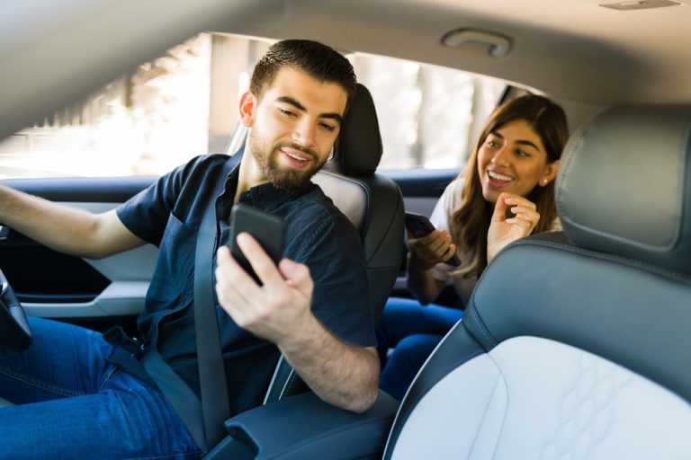 Rideshare driver in car with passenger