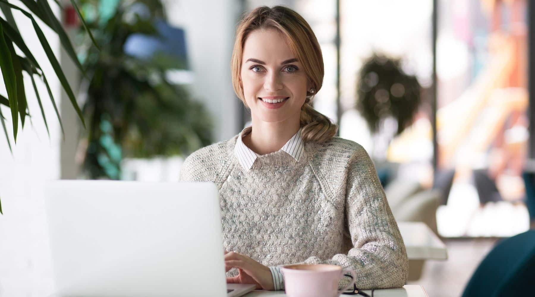 Woman using her laptop to find loan