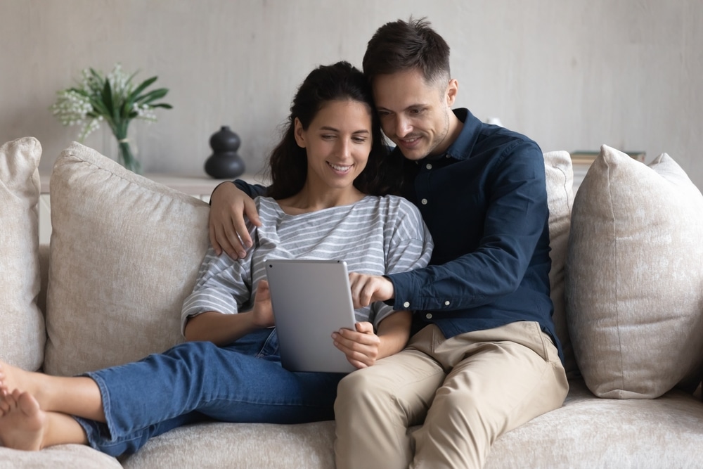Young couple checking personal loan rates online