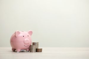 Piggy bank with extra cash savings