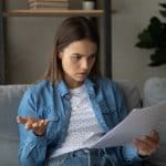 Young woman stressed over her rental contract