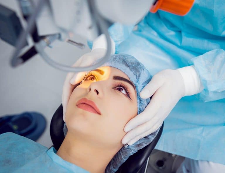 Health Insurance Banner - Young woman undergoing laser eye surgery