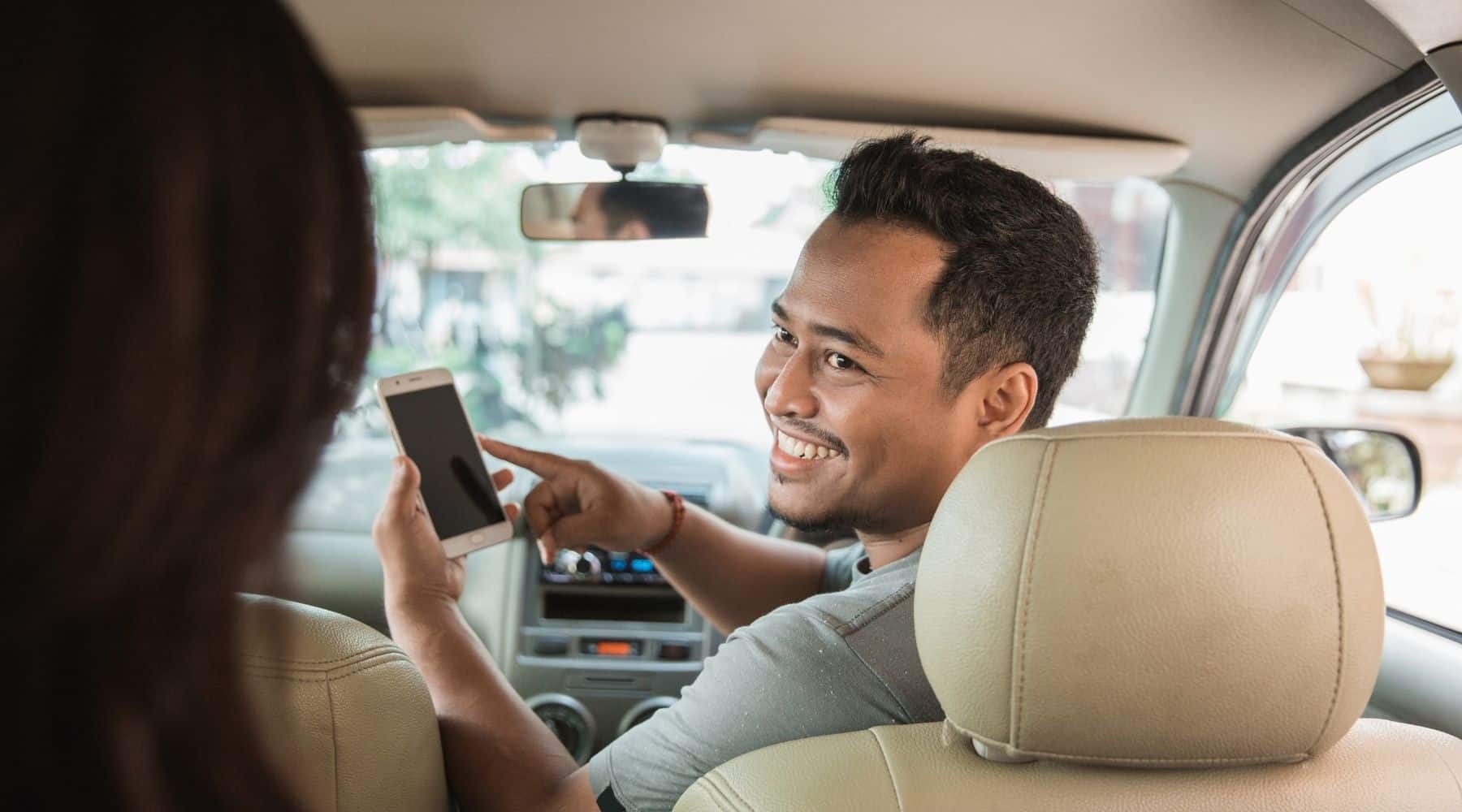 Uber rideshare driver with passenger in car