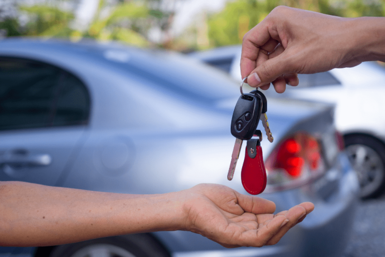 Car Loans Banner - Car buyer being handed the keys to their used, private-sale car