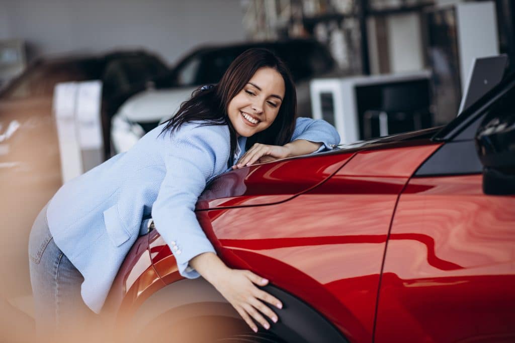 lady loving new car after getting car loan