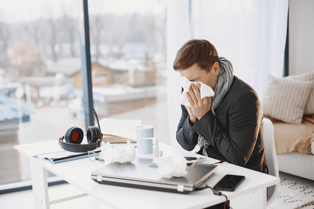 Sick employee at desk