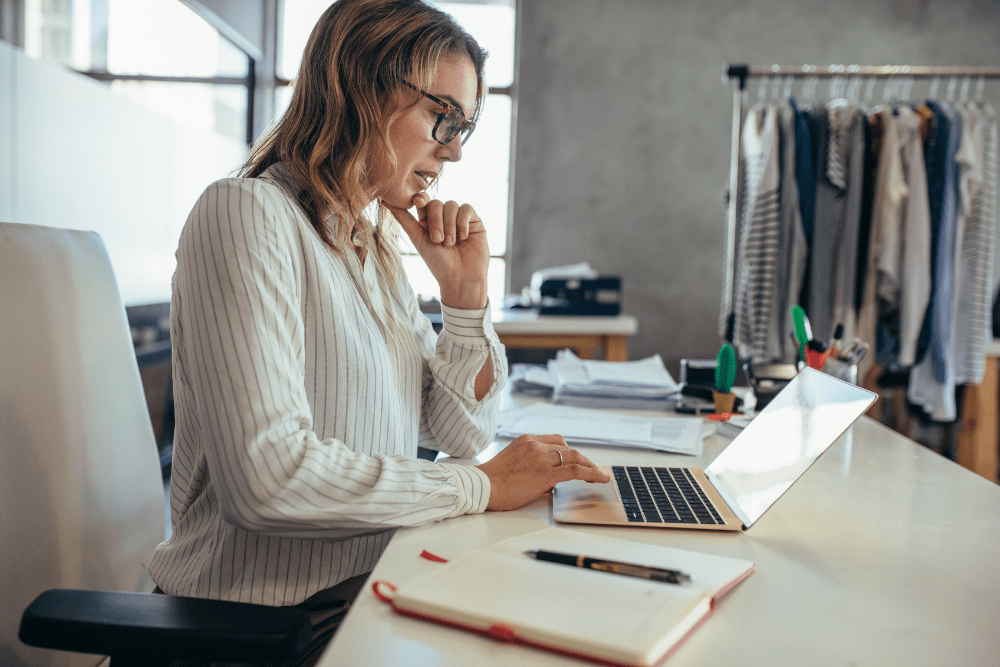 Businesswoman looking at her laptop in her office