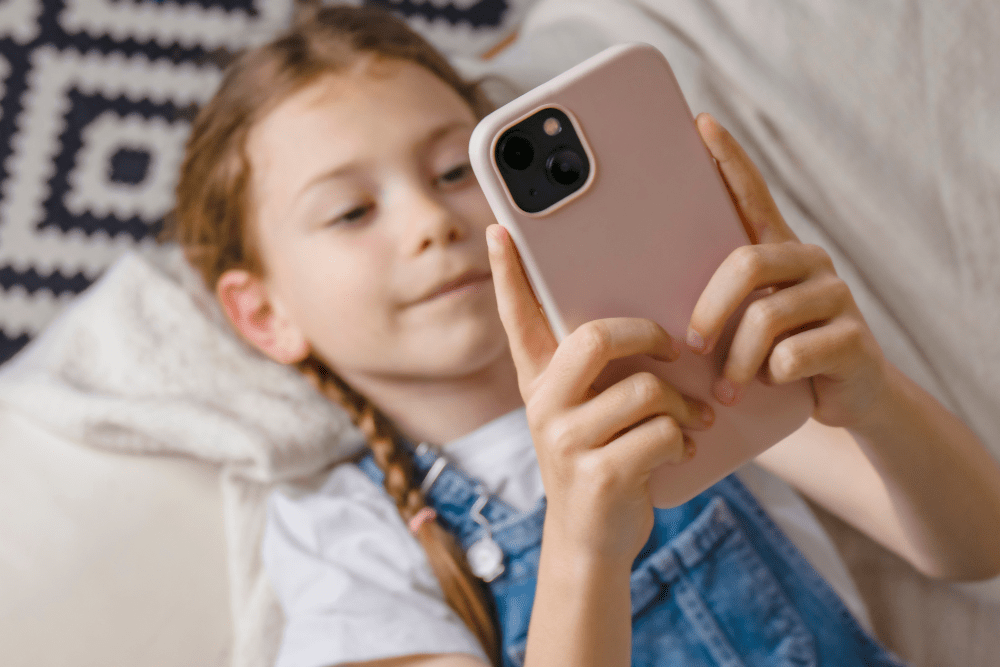 Young girl looking at her smartphone