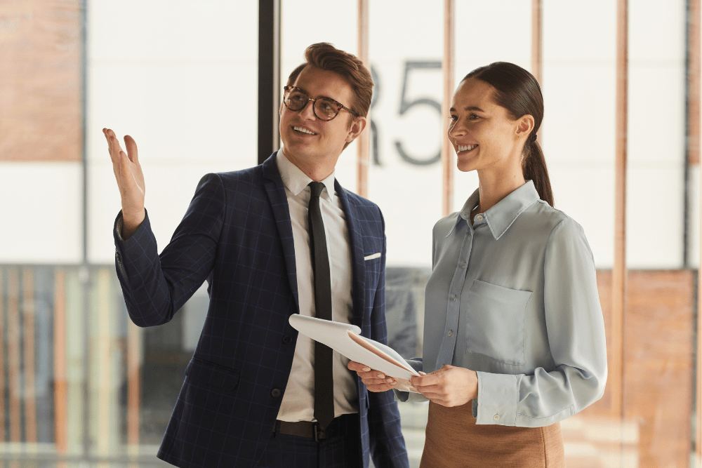 Businesswoman inspecting a commercial property with a real estate agent