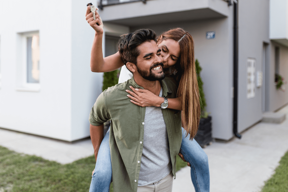 Couple celebrating buying a house