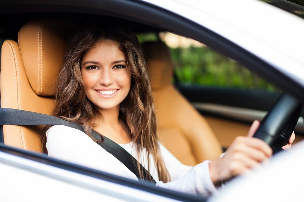 Woman driving her insured car