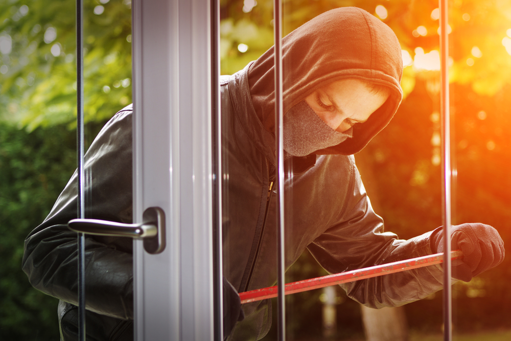 Burglar breaking into building