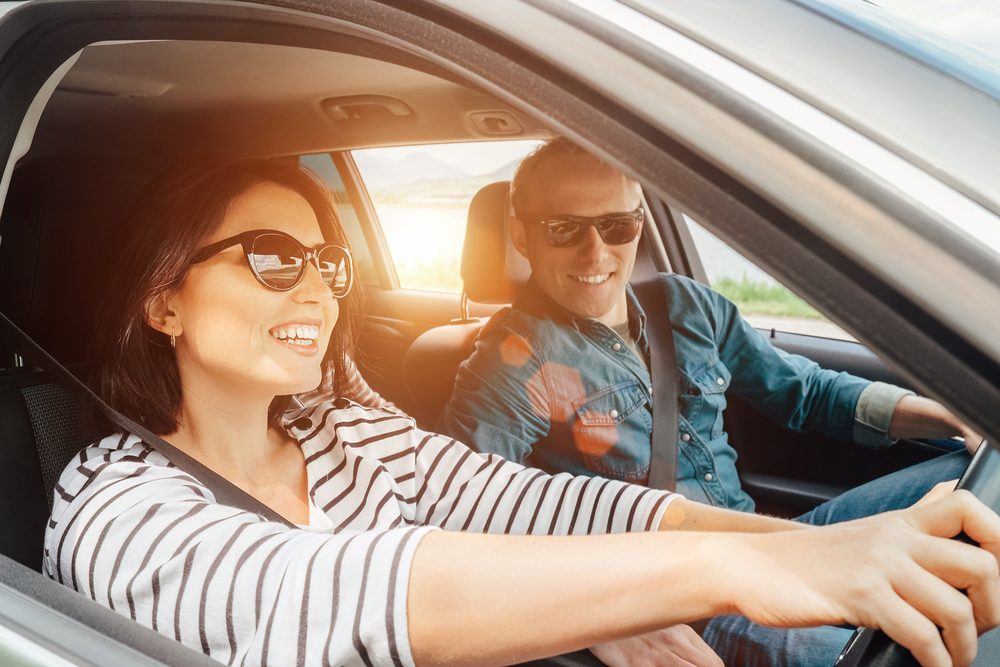 Couple driving in their car