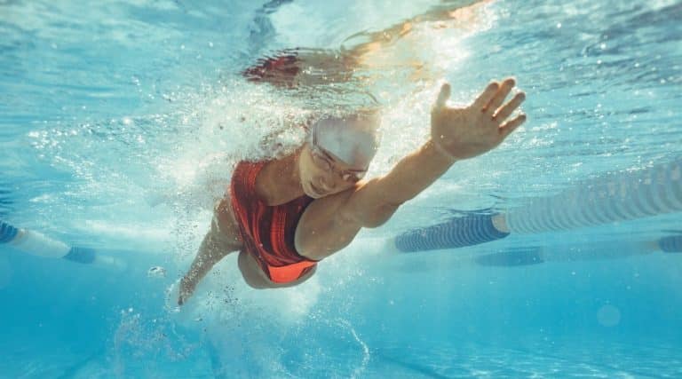 A female athlete swimming in a pool
