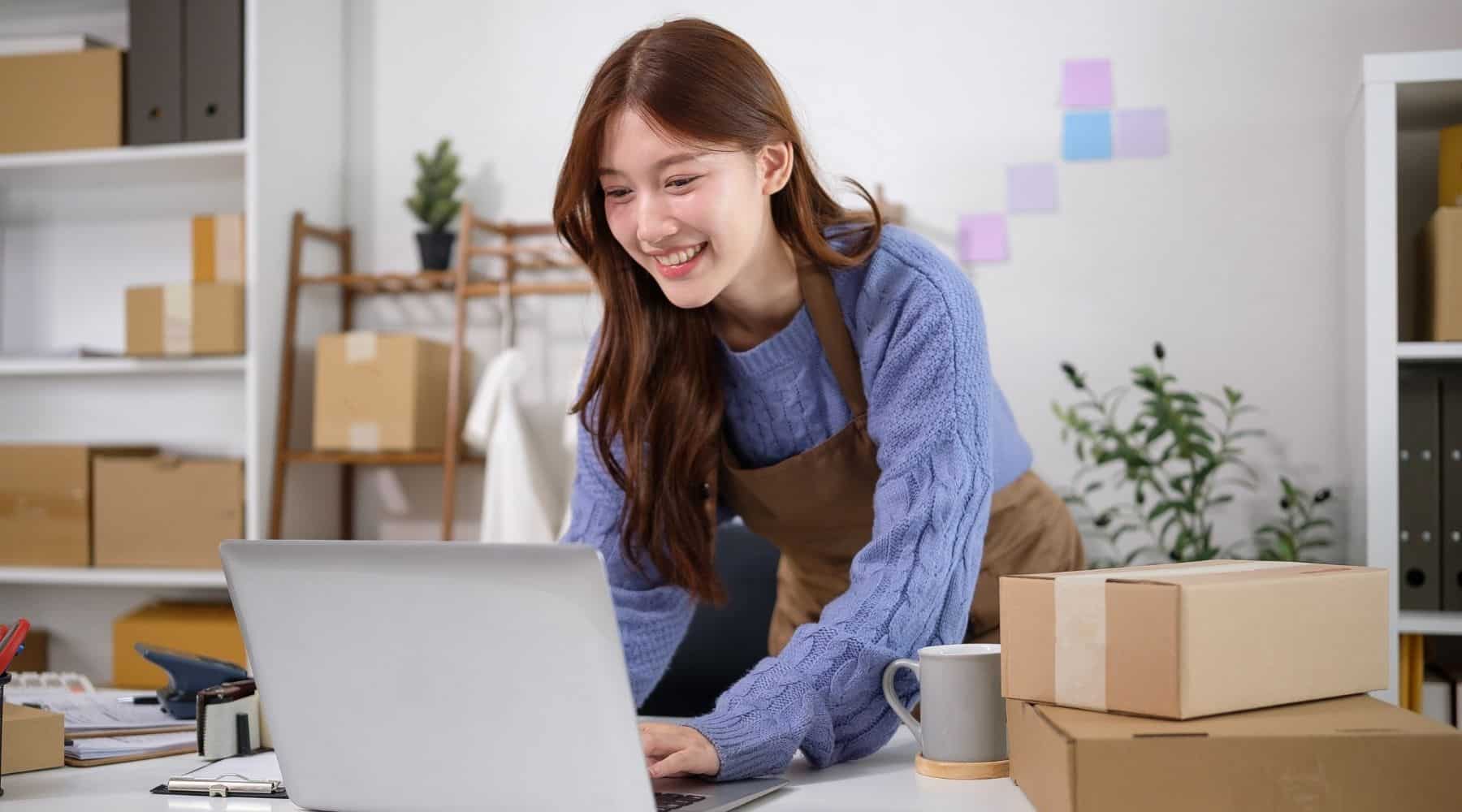 A businesswoman using her laptop at work