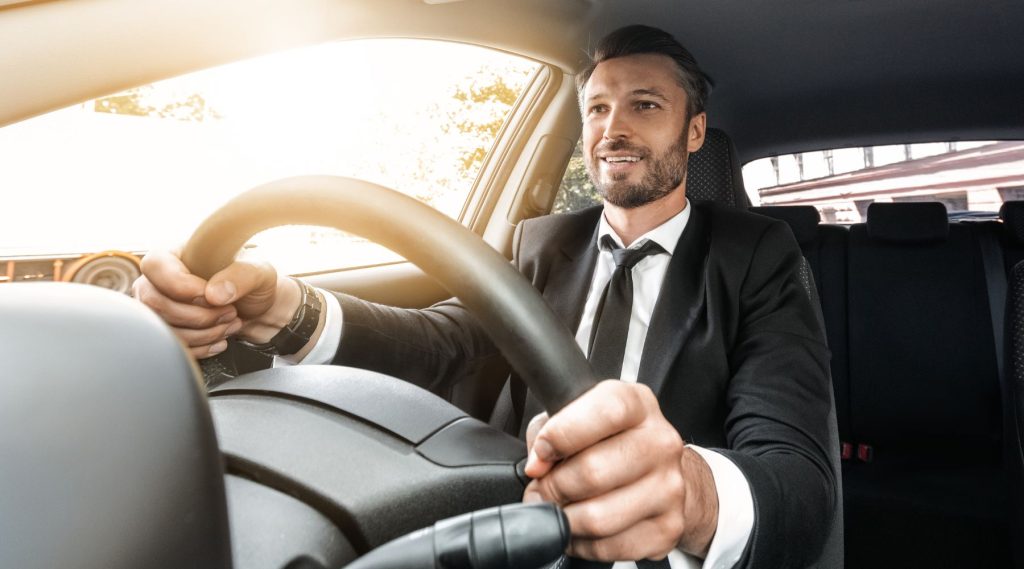 Businessman driving car