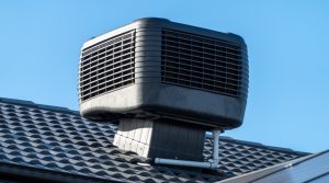 A ducted evaporative air conditioner unit of the roof of a house