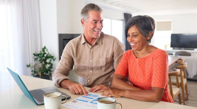 A man and woman looking at an energy bill.