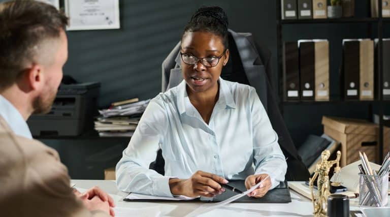 Lawyer discussing a case with a client in her office
