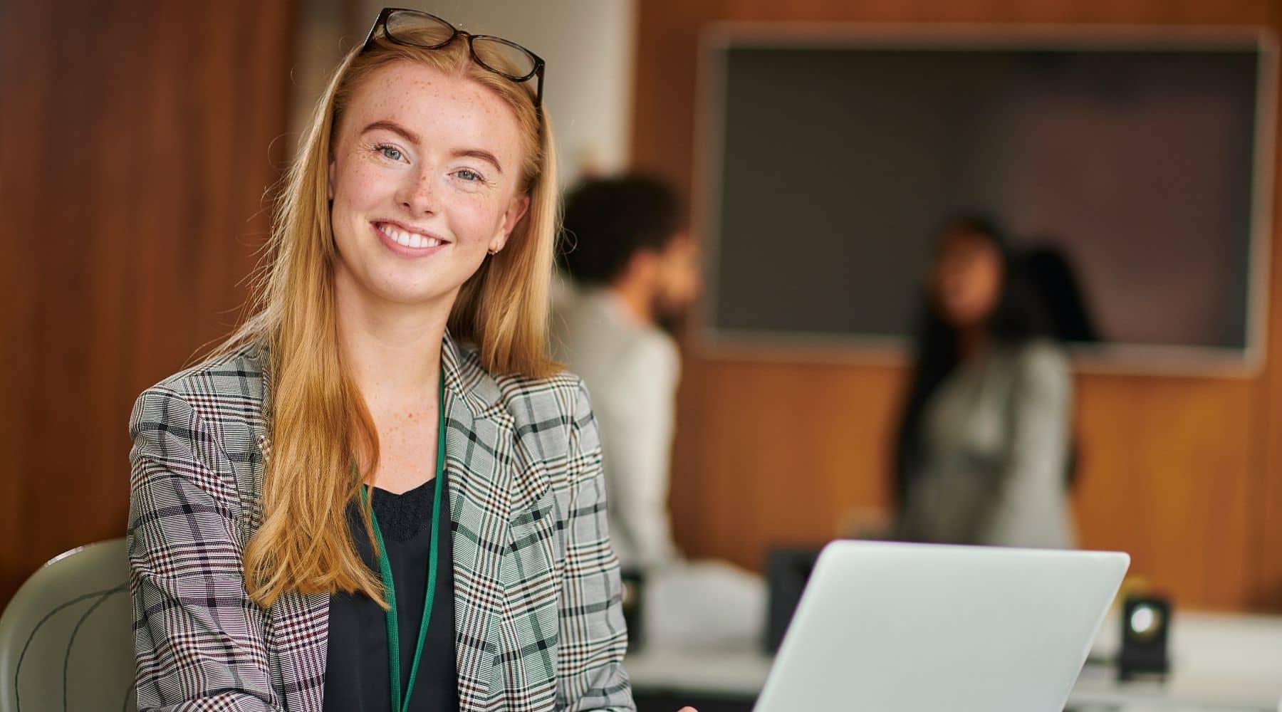 Young woman at her laptop at work