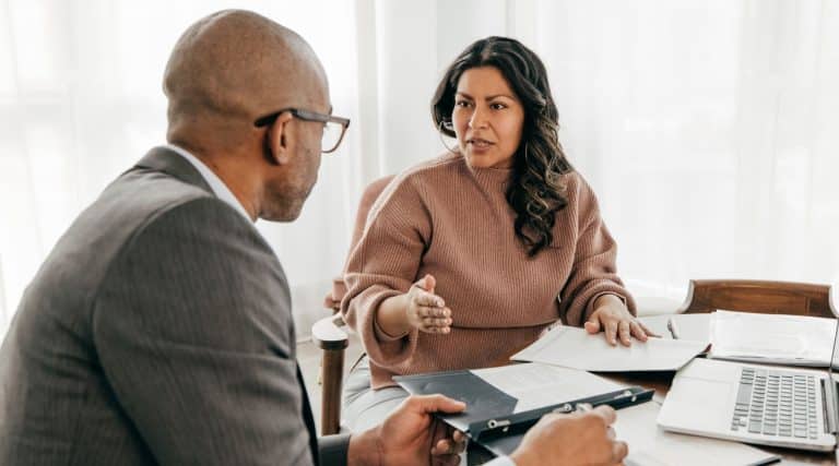 Woman meeting with a broker to discuss a loan