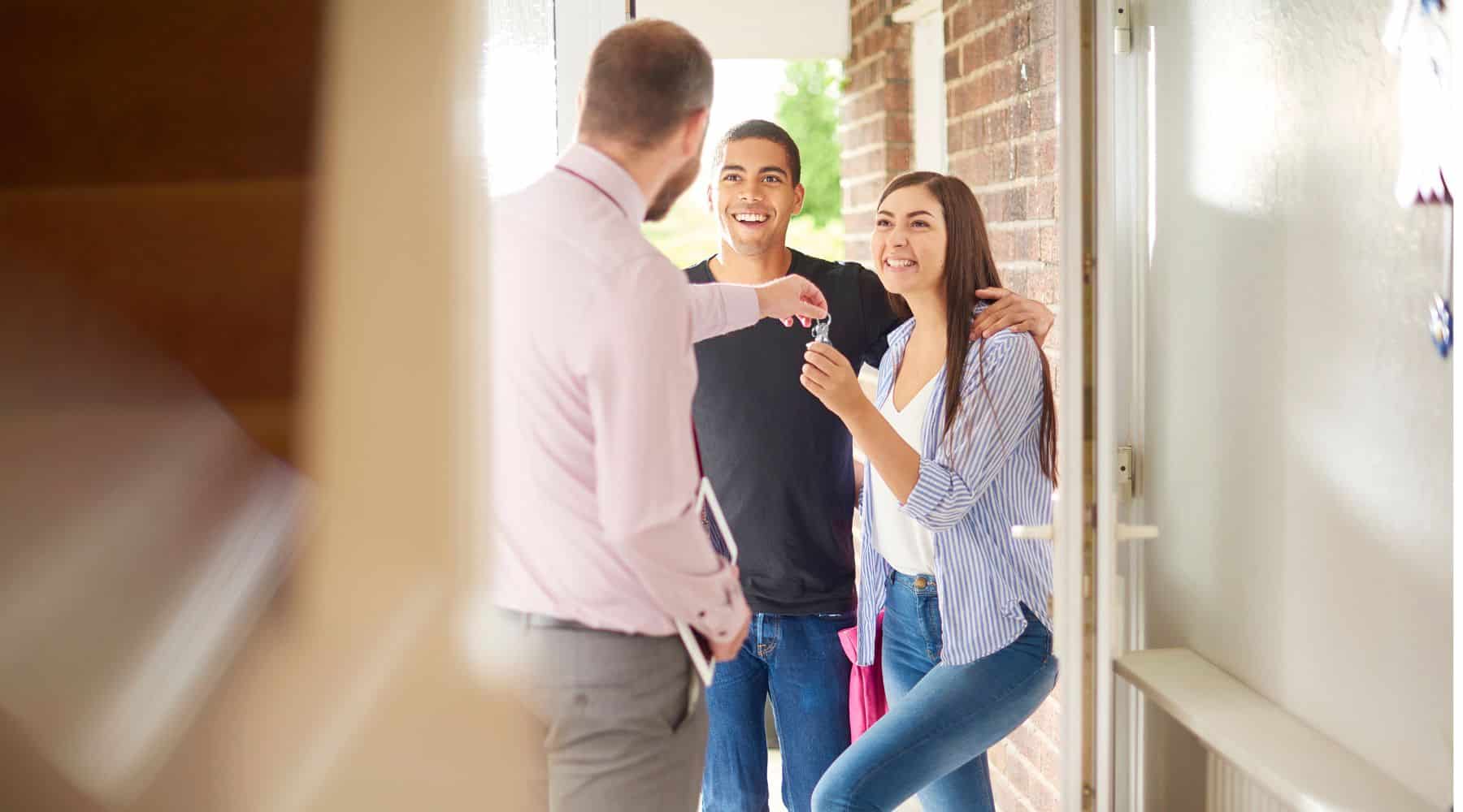 Couple getting the keys to their new home