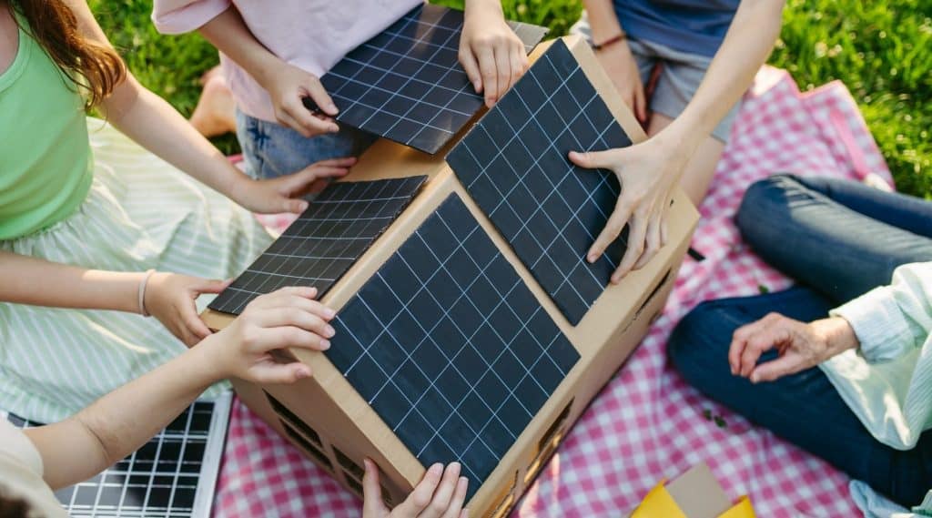 People put solar panels on a model house