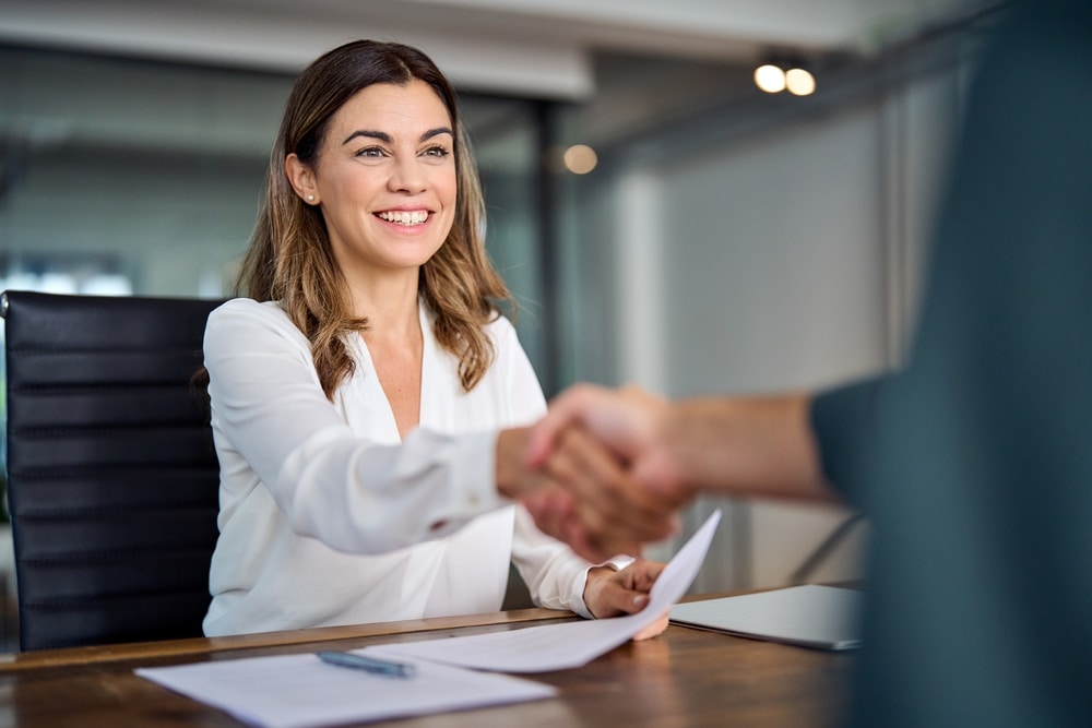 Business owner shaking hands on deal