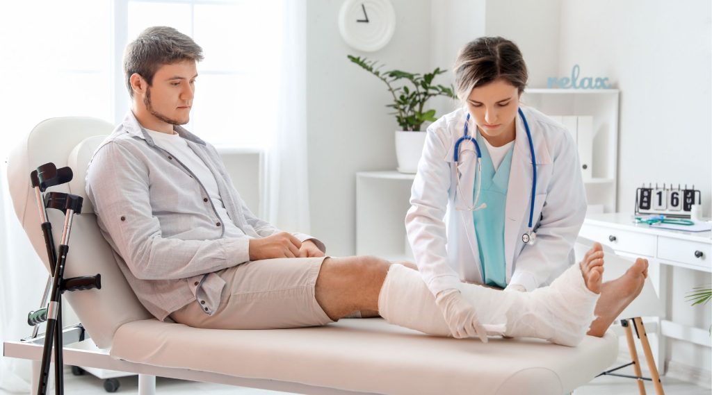 Man with broken leg visiting doctor