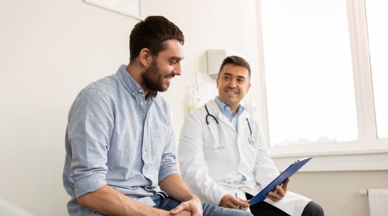 Young man speaking to his doctor