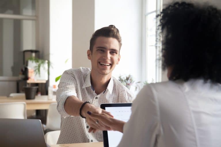 Smiling man shaking hands