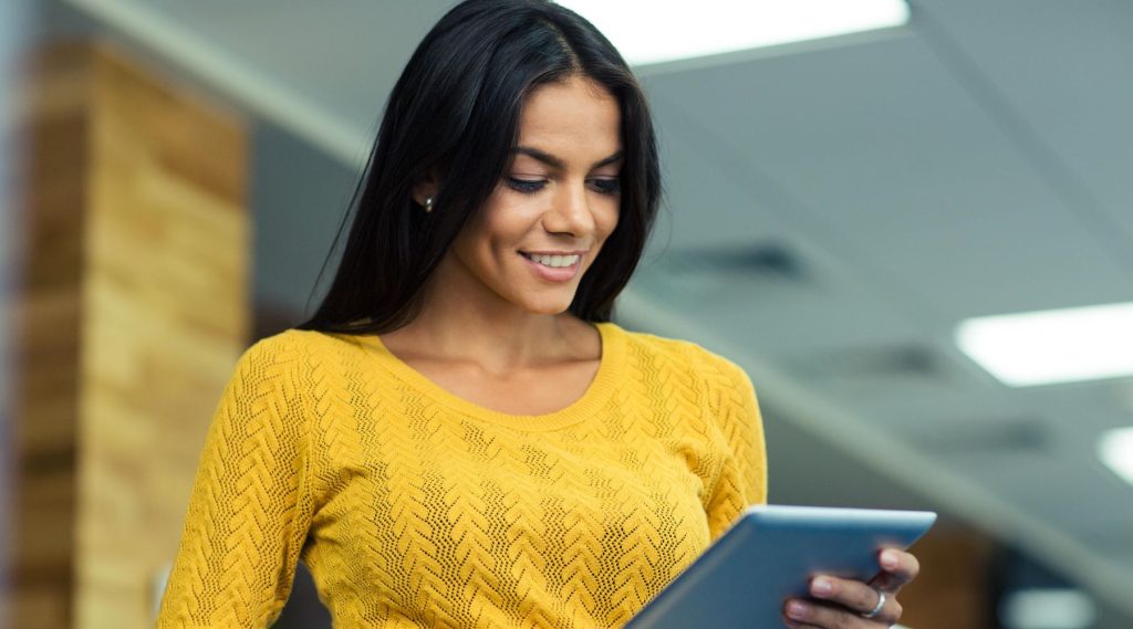 Woman looking at her tablet