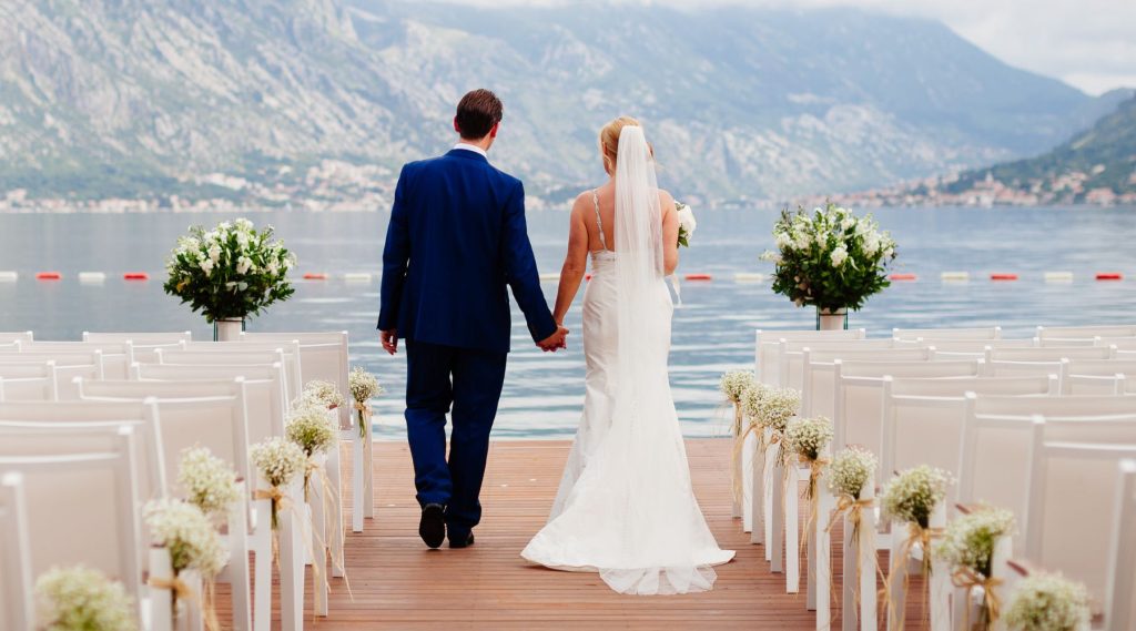 Couple at their wedding overlooking water