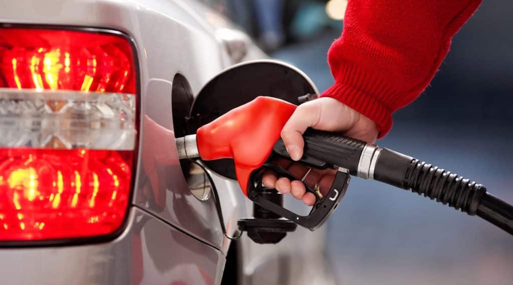 Woman filling up car with petrol