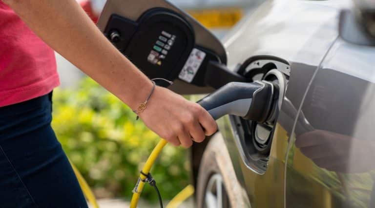 A person charging their electric vehicle