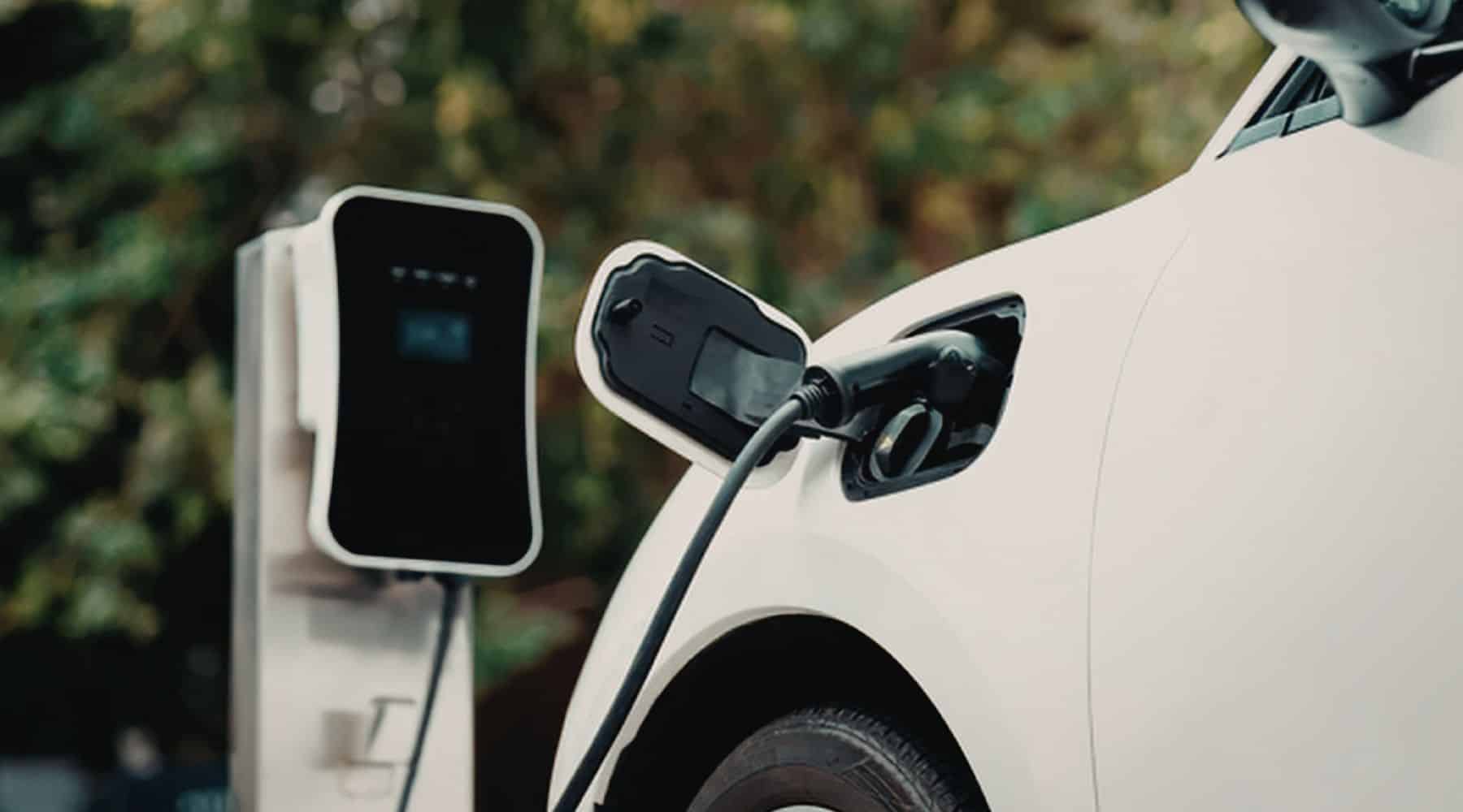 White EV being charged