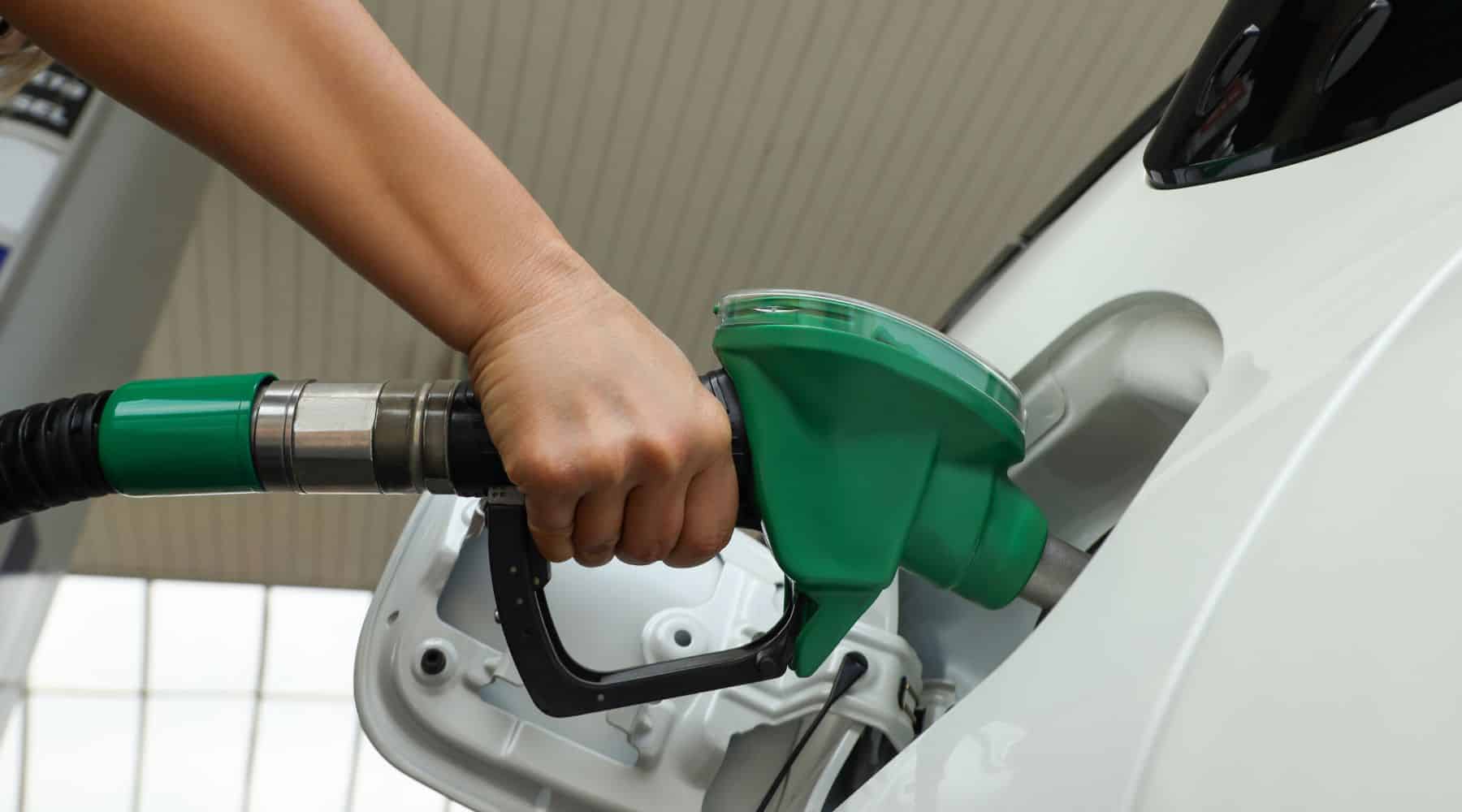 Driver filling up their car with fuel