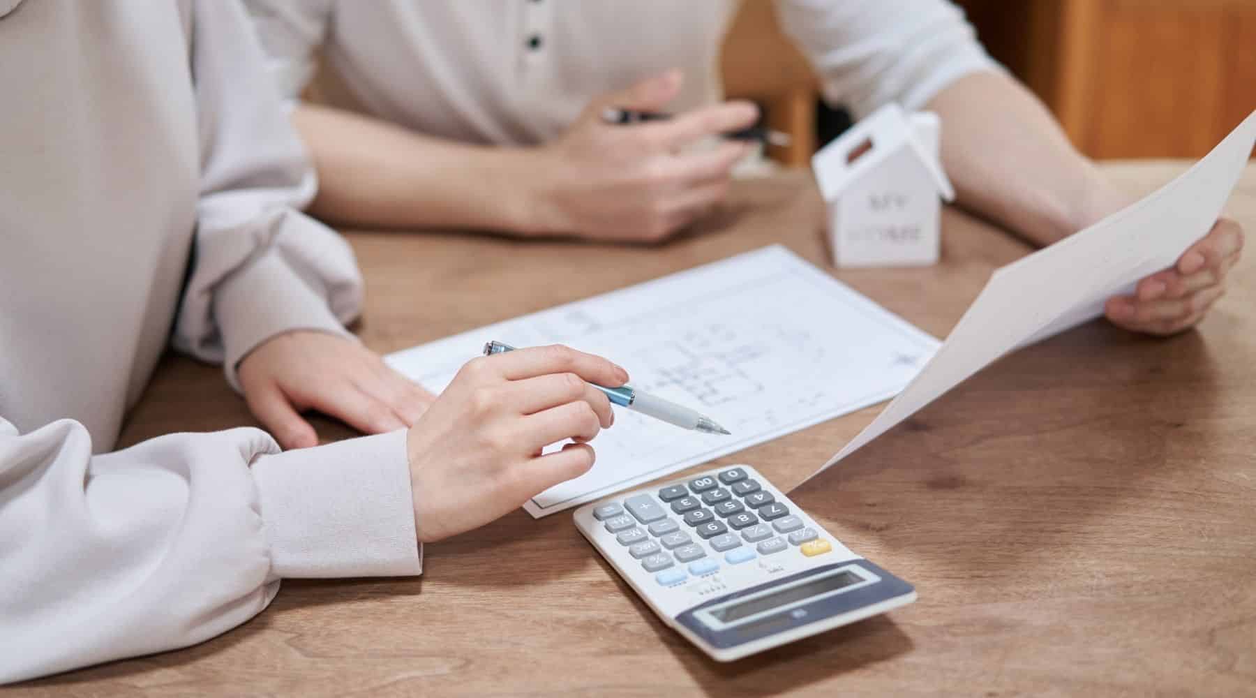 People calculating property costs