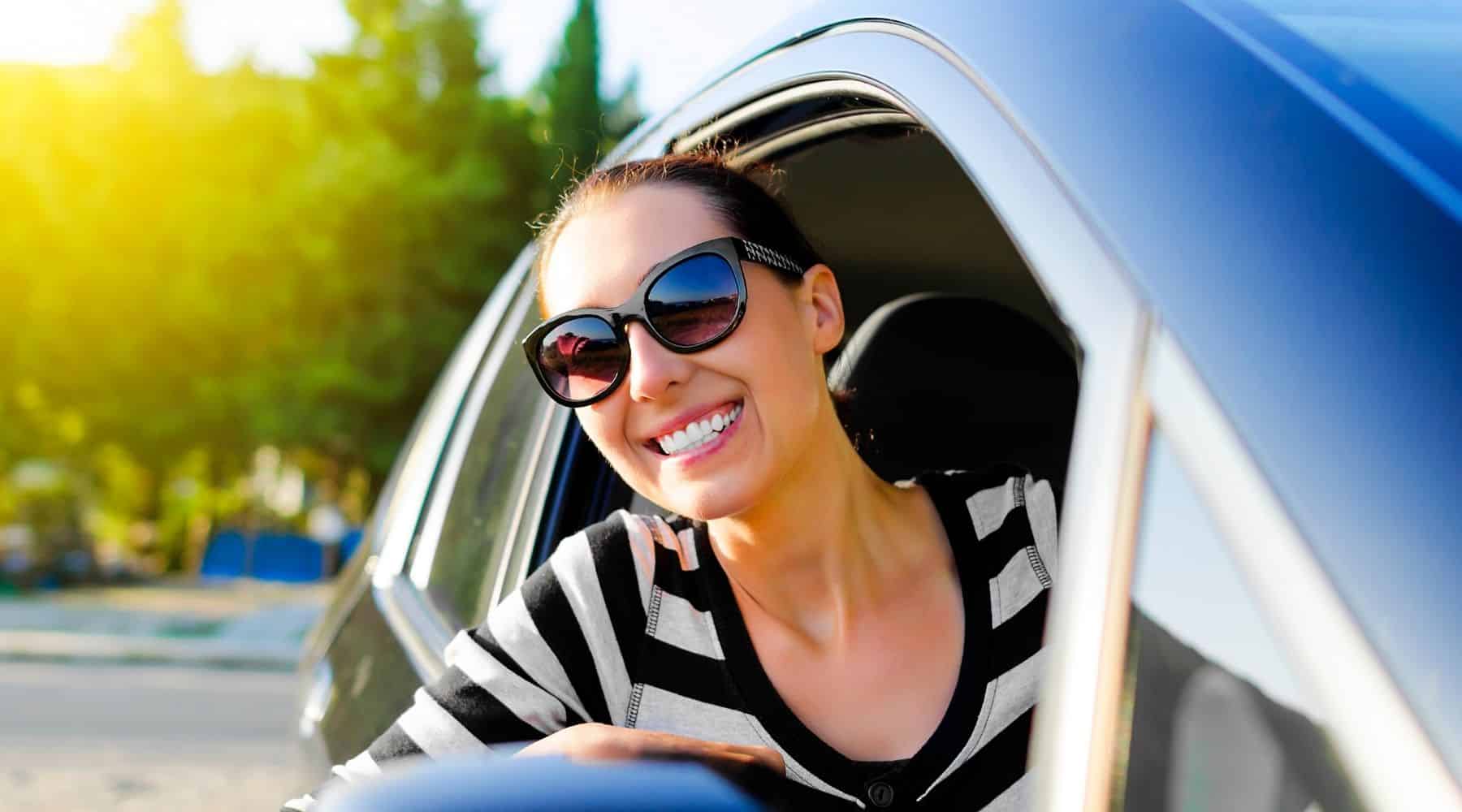 Smiling woman in her car