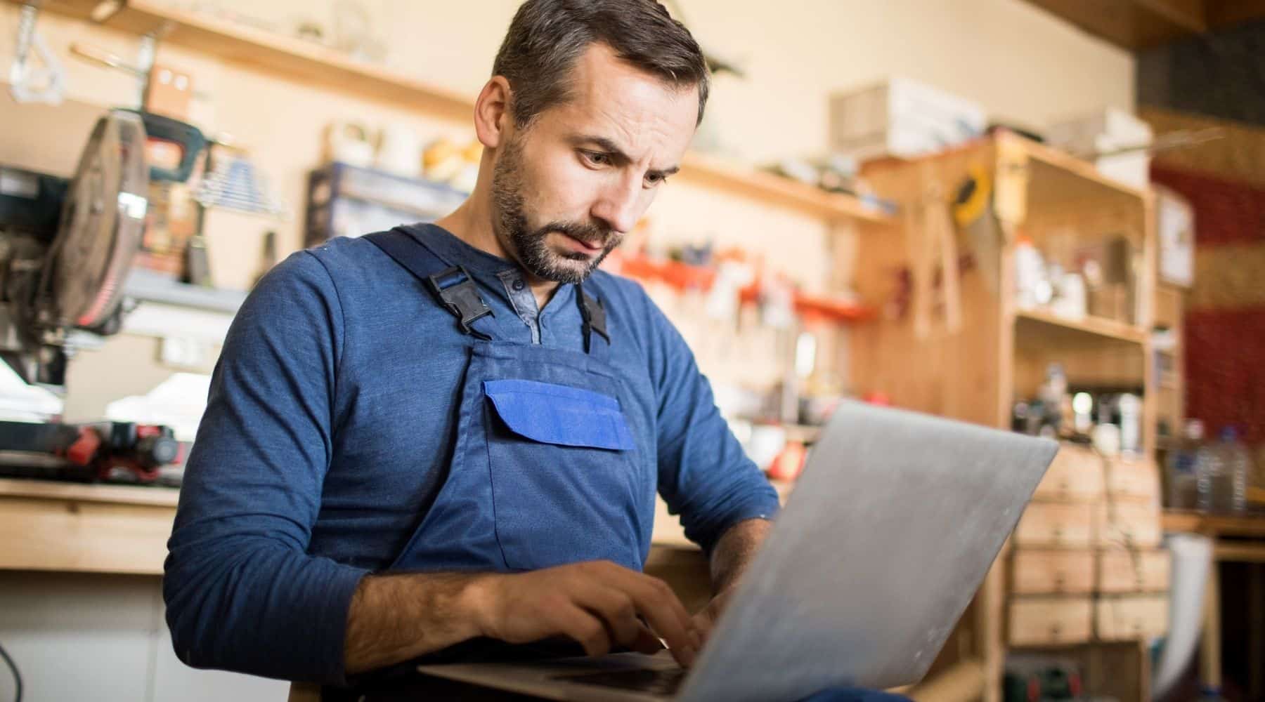 Small business owner using his laptop